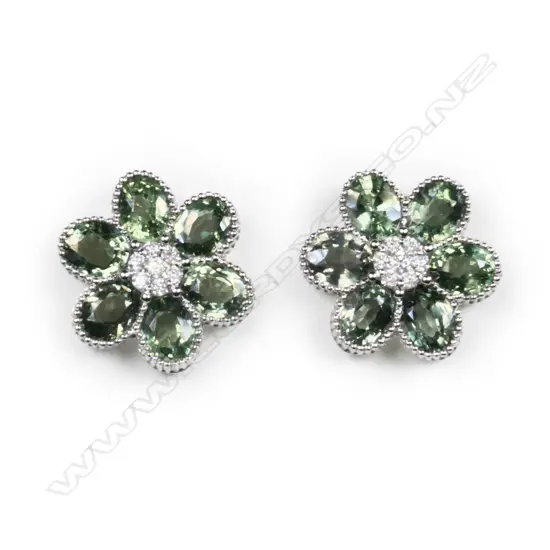 A 14ct white gold, green Ceylon sapphire and diamond flower design stud earrings,