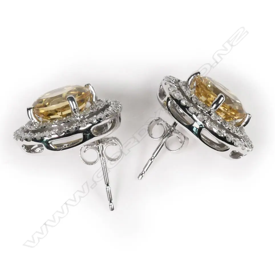 A pair of 14ct white gold, heliodor and diamond double halo earrings, Image 1++