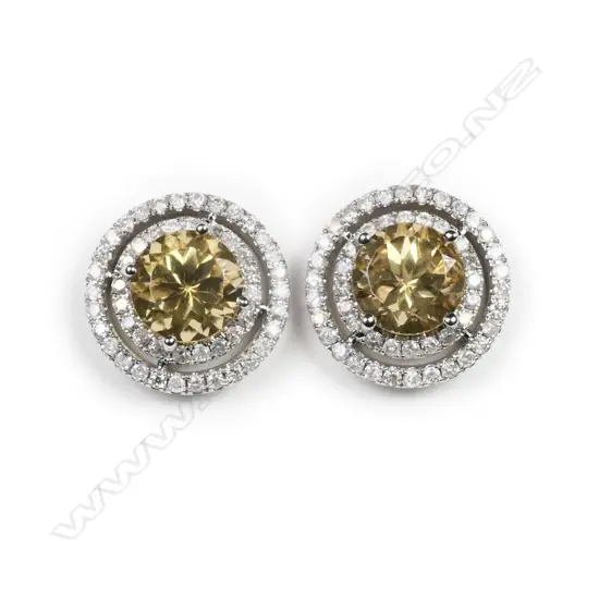 A pair of 14ct white gold, heliodor and diamond double halo earrings,