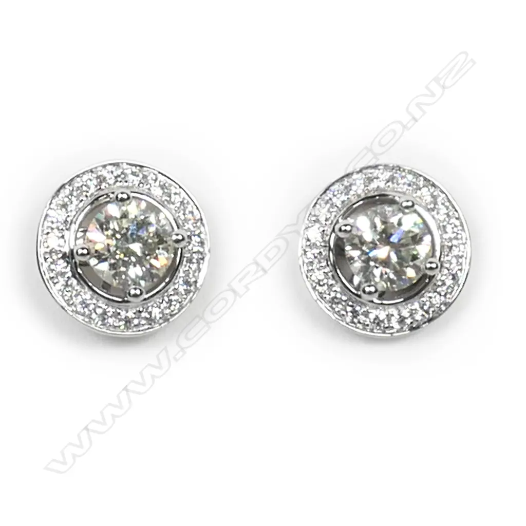 A pair of 18ct white gold and diamond stud earrings, Image 1++