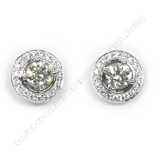 A pair of 18ct white gold and diamond stud earrings,