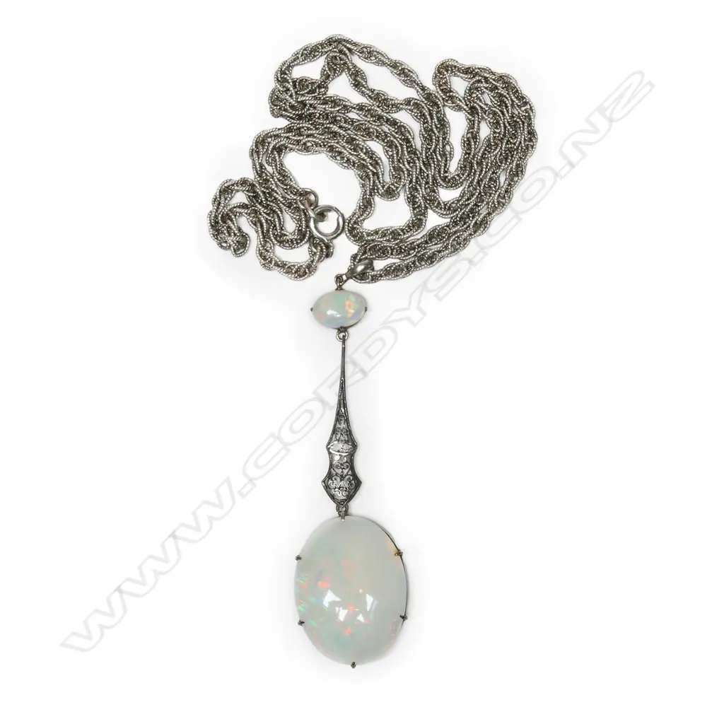 A stylish early 20thC silver and large opal pendant on chain, Image 1++
