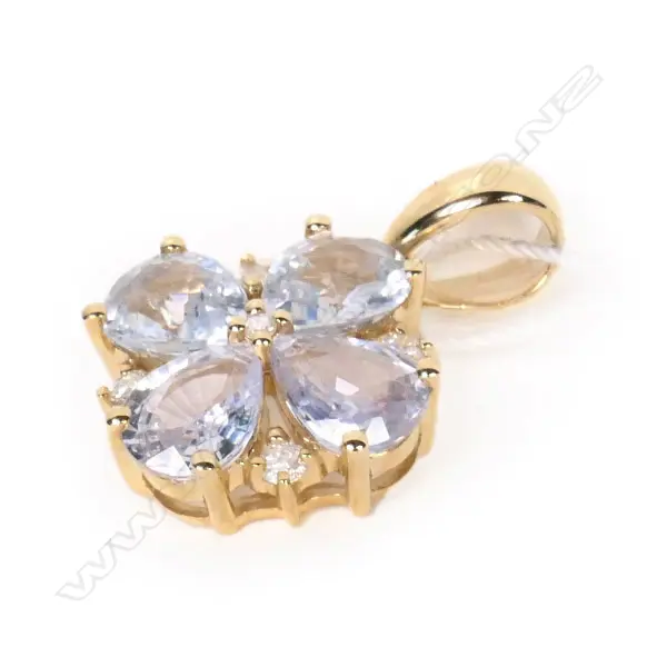 A 14ct gold sapphire and diamond flower pendant Image 1++