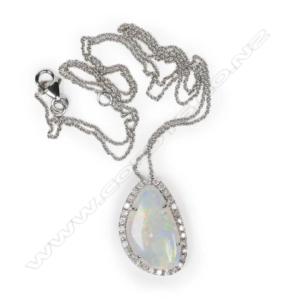 A 14ct white gold, Australian opal and diamond halo pendant, Image 1++