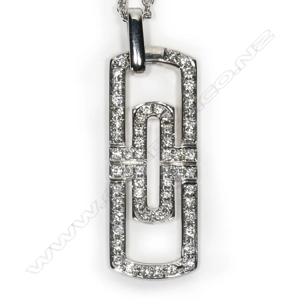 An 18ct white gold and diamond pendant on chain, Image 1++