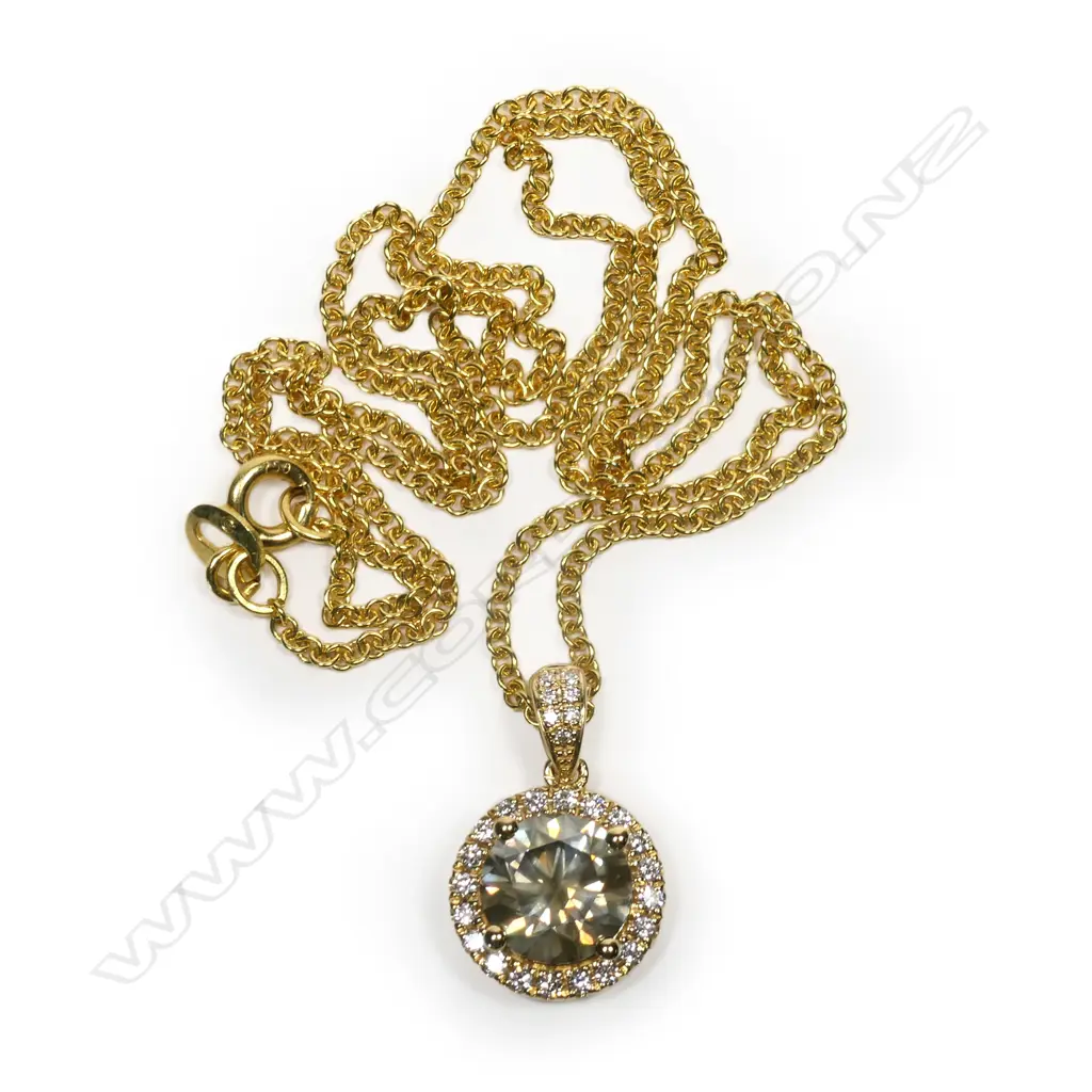 An 18ct gold and diamond pendant and chain, Image 1++