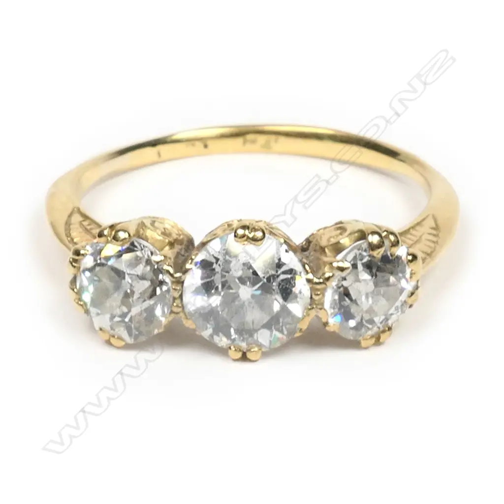 An estate 18ct. gold and three stone diamond ring, Image 1++