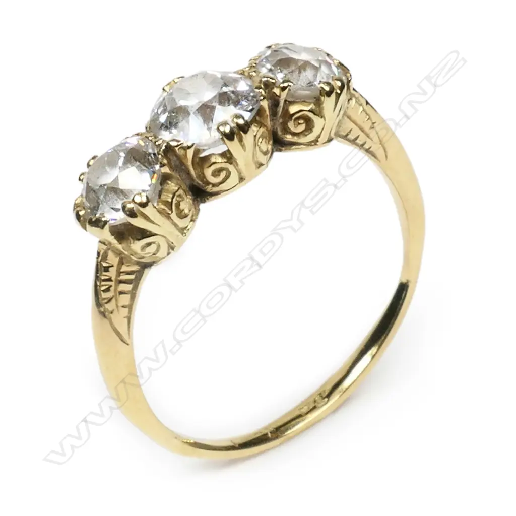 An estate 18ct. gold and three stone diamond ring, Image 1++