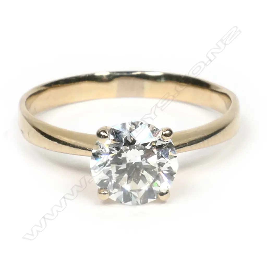 An 18ct gold and diamond solitaire ring, Image 1++