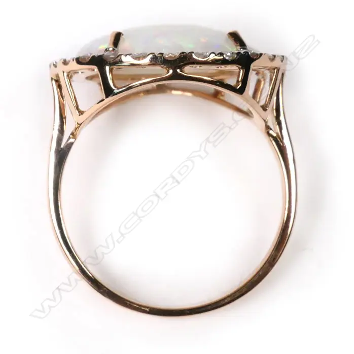 A 14ct rose gold, opal and diamond halo cocktail ring, Image 1++