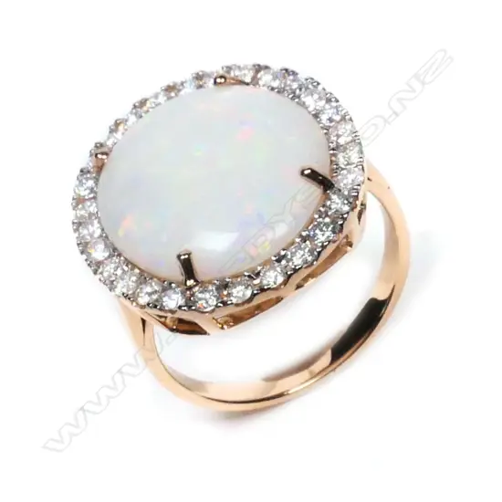 A 14ct rose gold, opal and diamond halo cocktail ring,