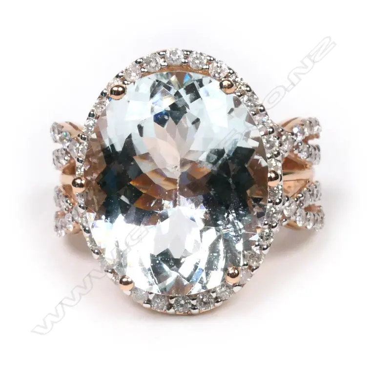 A 14ct rose gold, aquamarine and diamond halo cocktail ring, Image 1++