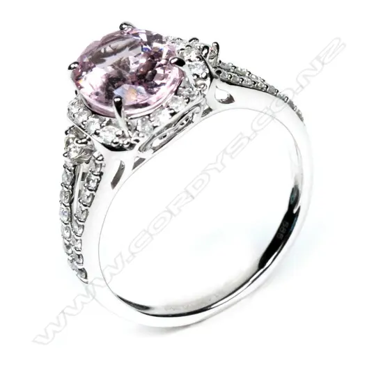 A 14ct white gold morganite and diamond halo ring,