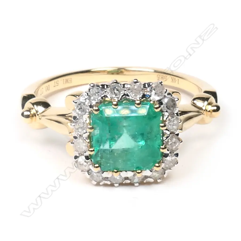 A 14ct gold, Colombian emerald and diamond halo ring, Image 1++
