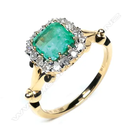A 14ct gold, Colombian emerald and diamond halo ring,
