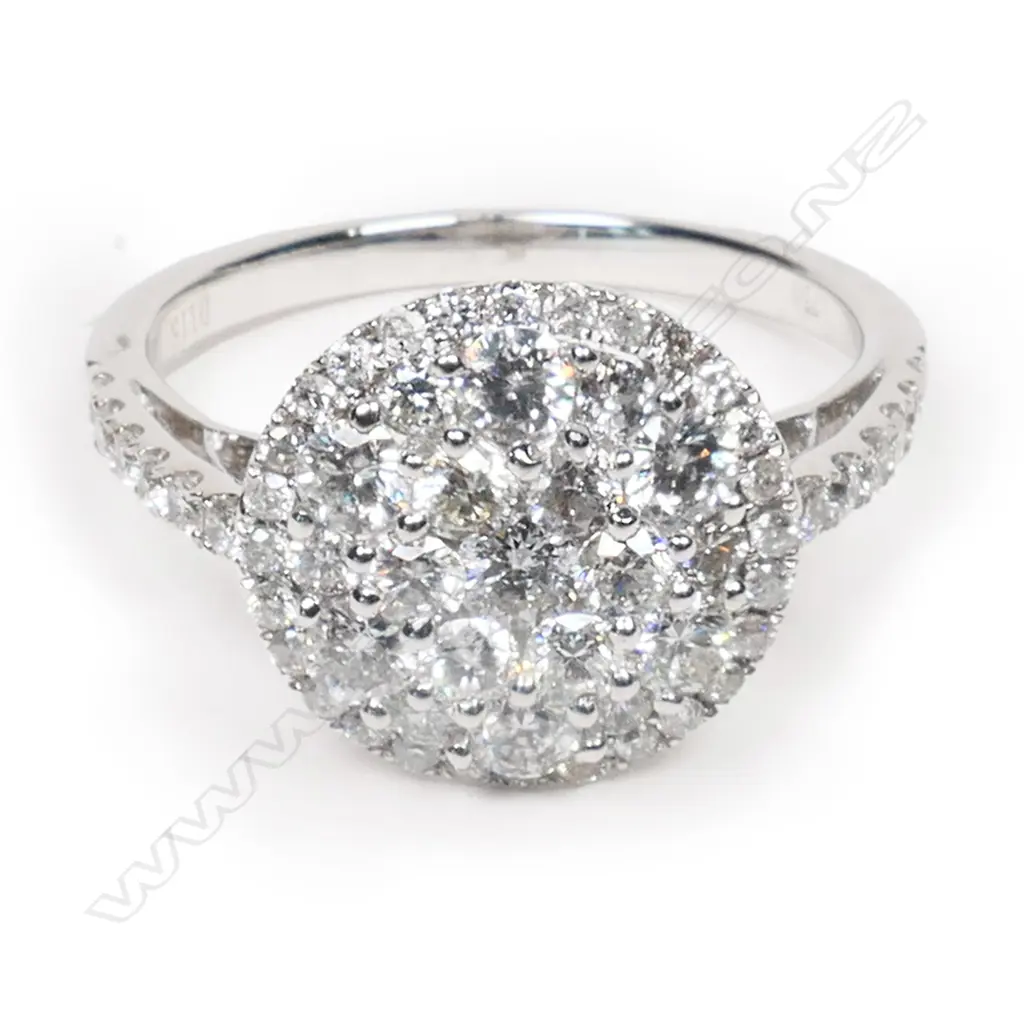 An 18ct white gold and diamond cluster ring, Image 1++