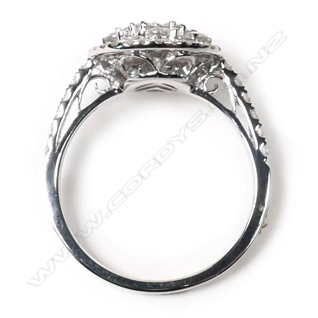 An 18ct white gold and diamond cluster ring, Image 1++