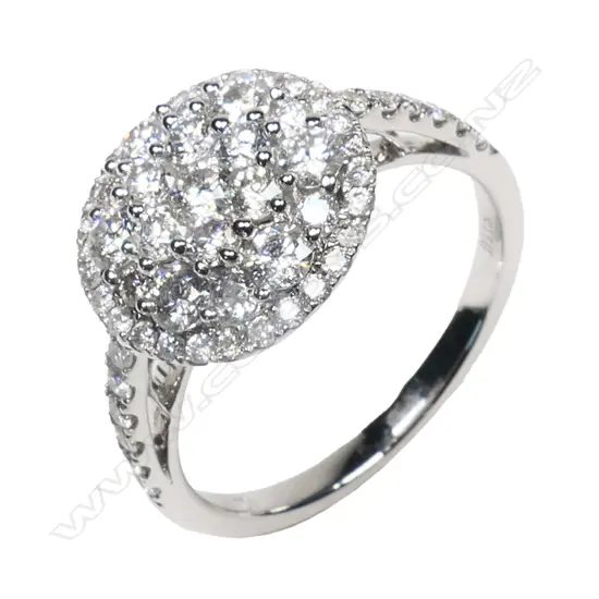 An 18ct white gold and diamond cluster ring,