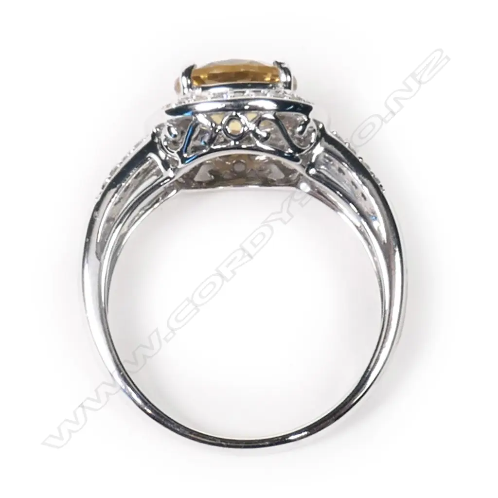 A 14ct white gold, heliodor and diamond halo ring, Image 1++