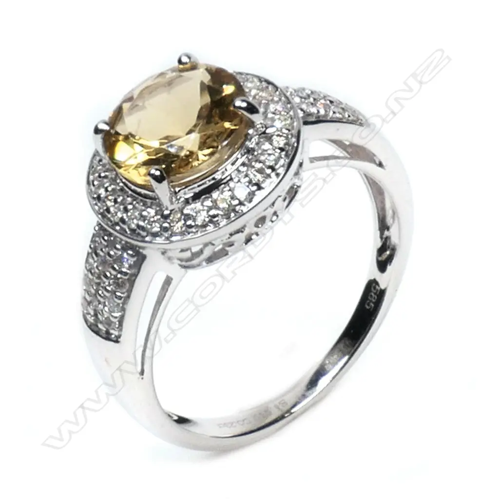 A 14ct white gold, heliodor and diamond halo ring, Image 1++