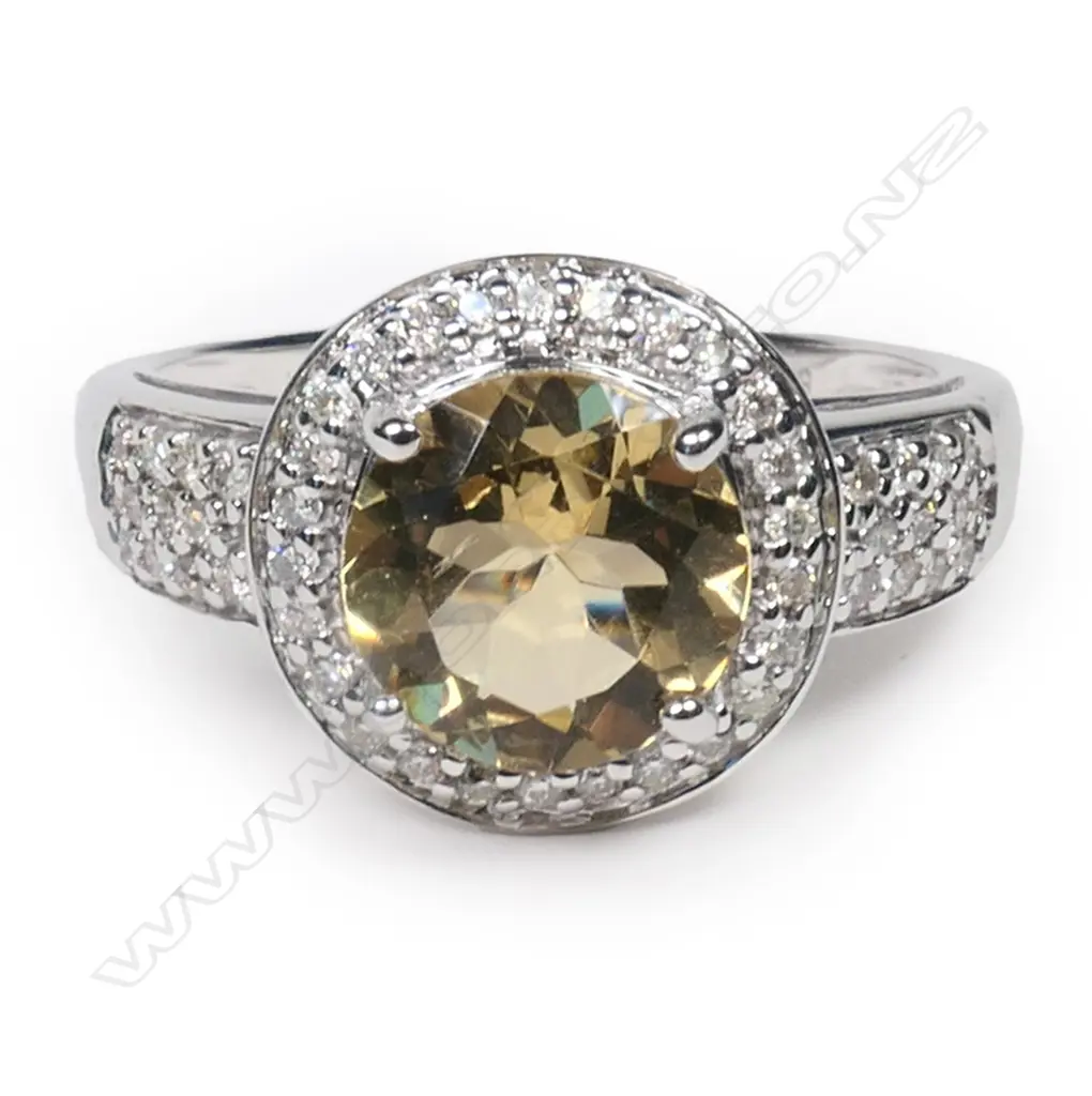 A 14ct white gold, heliodor and diamond halo ring, Image 1++
