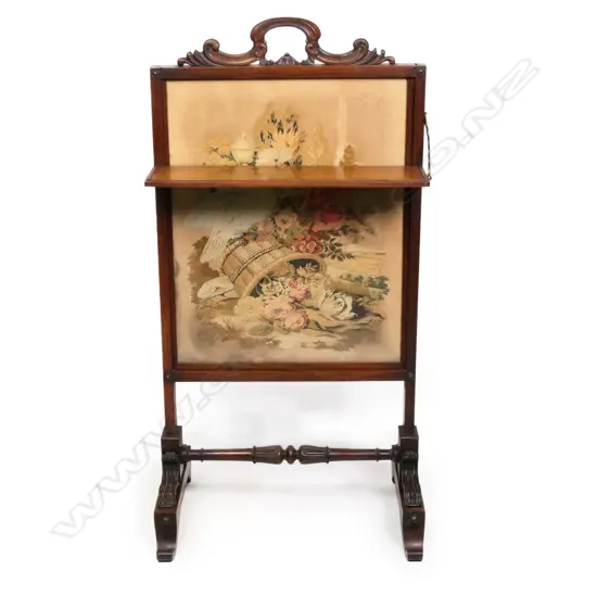 A Victorian rosewood embroidered fire screen,