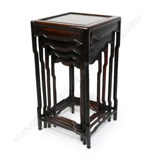 A set of four Chinese rosewood nesting tables,