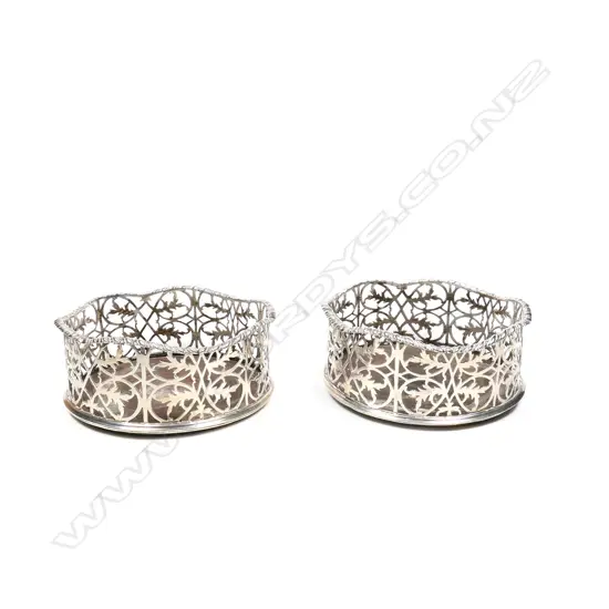 A pair of early George III wine coasters,