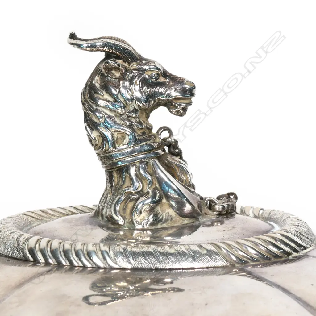 A William IV silver food dome with a cast handle modelled as the crest of the Holloway family, an antelope's head collared and chained at it's breast a crescent, Image 1++