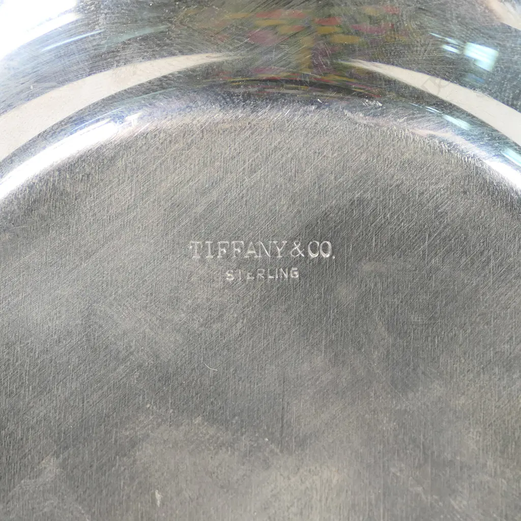 A Tiffany & Co. silver champagne bottle coaster, Image 1++