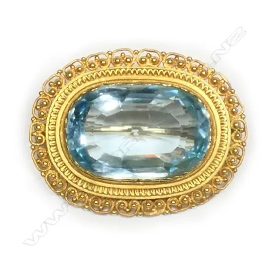 A 20ct gold and aquamarine brooch,