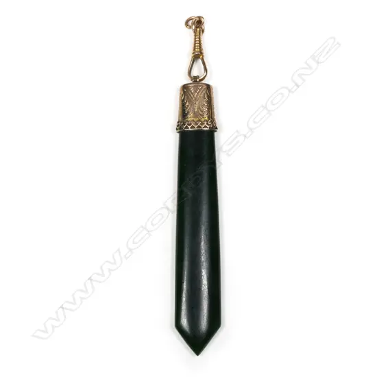 A colonial unmarked gold and pounamu pendant,