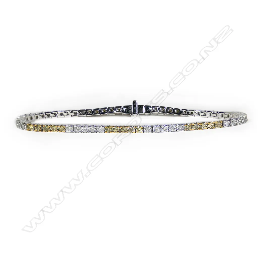 A 14ct white gold and fancy yellow diamond tennis bracelet, Image 1++