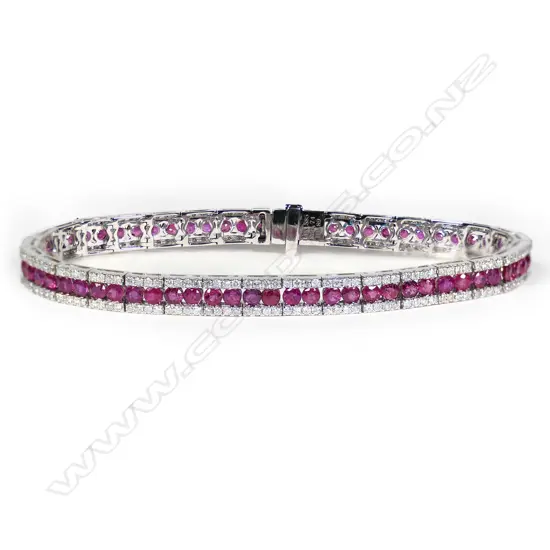 A 14ct white gold, ruby and diamond line bracelet,