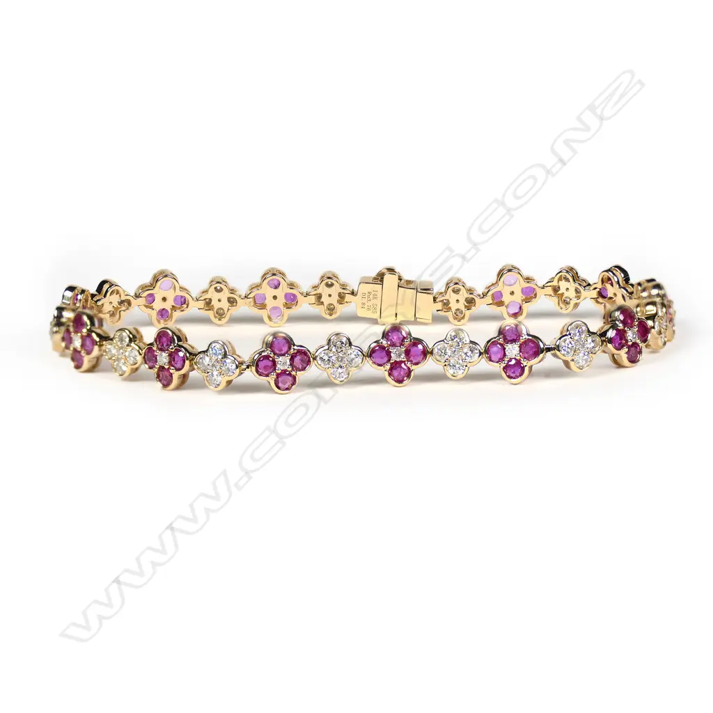 A 14ct gold, ruby and diamond floral design bracelet, Image 1++