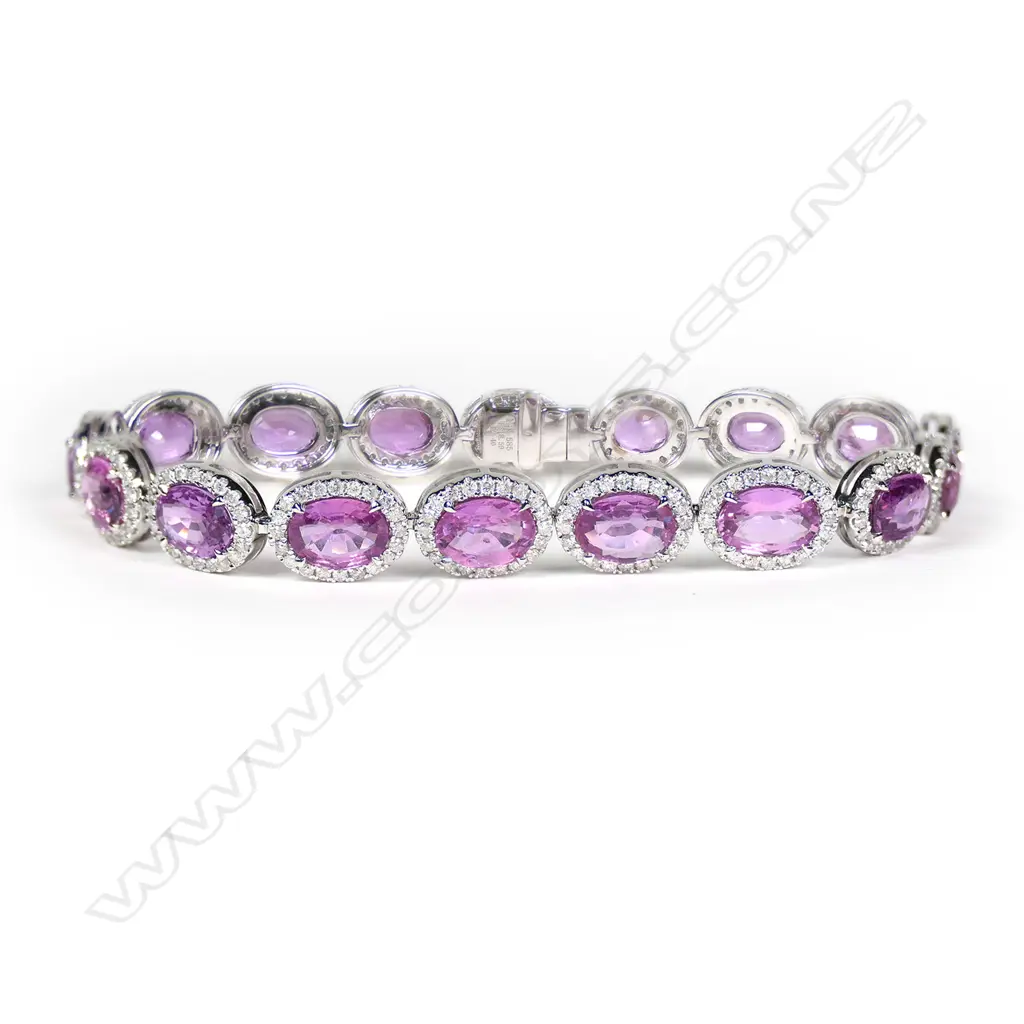 A 14ct white gold, pink sapphire and diamond halo tennis bracelet, Image 1++