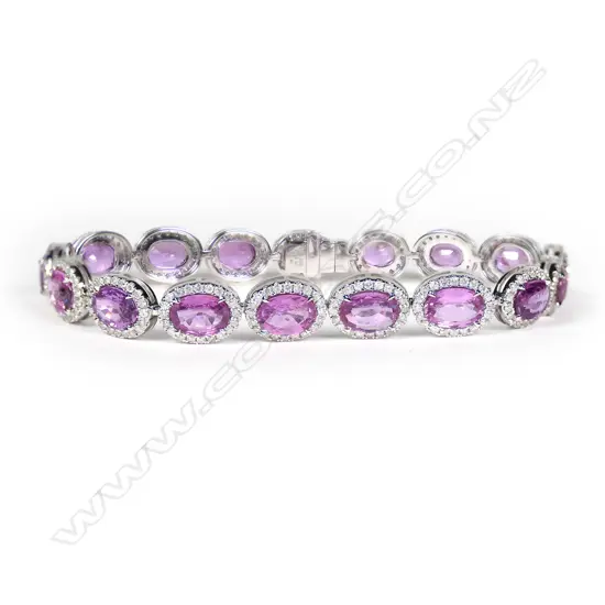 A 14ct white gold, pink sapphire and diamond halo tennis bracelet,