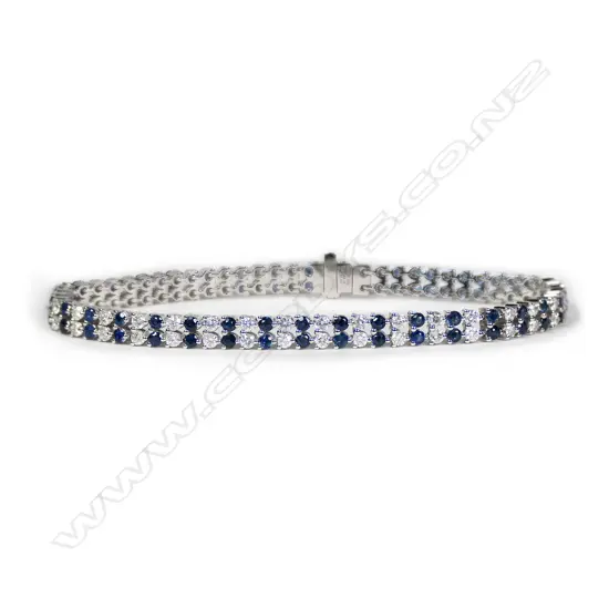 A 14ct white gold, sapphire and diamond tennis bracelet,