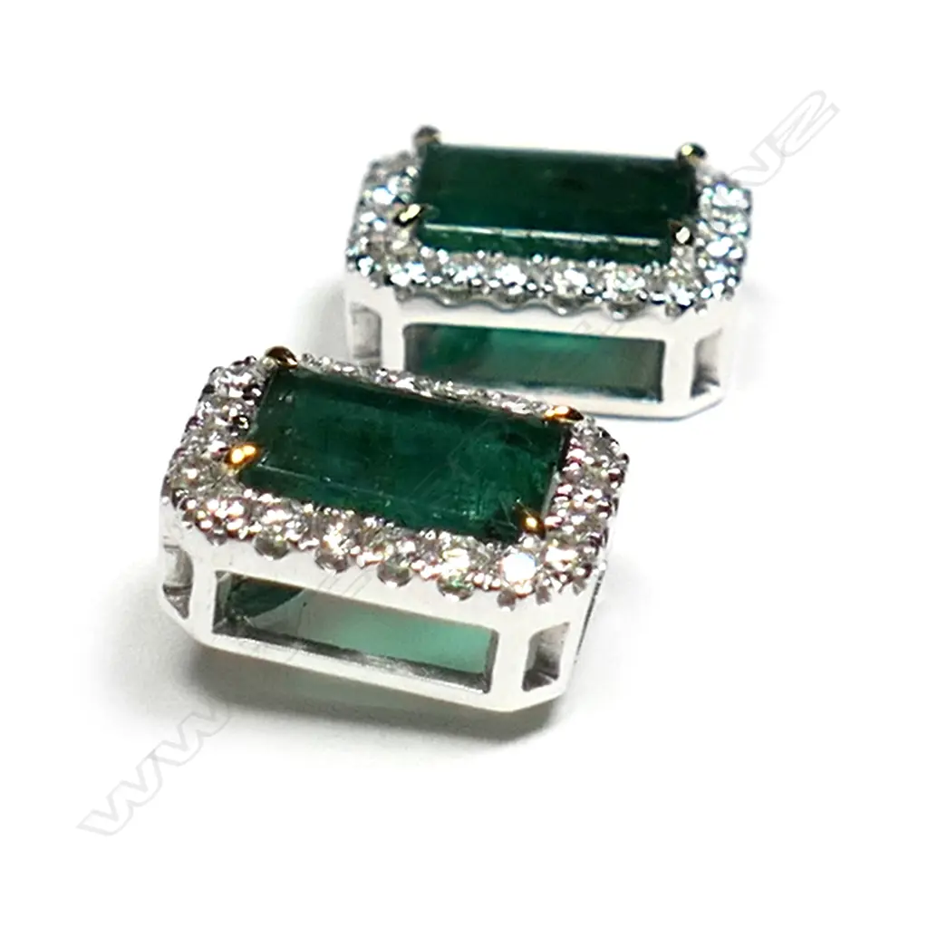 A pair of 14ct white gold, emerald and diamond halo stud earrings, Image 1++