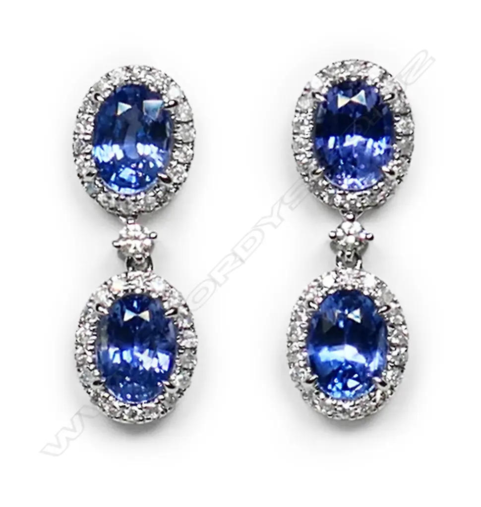 A pair of 14ct white gold, Ceylon sapphire and diamond halo drop earrings, Image 1++