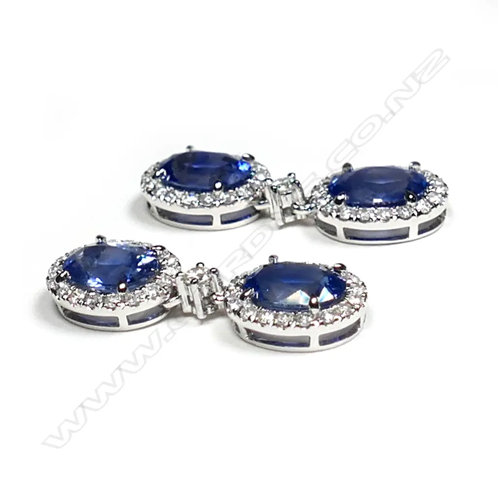 A pair of 14ct white gold, Ceylon sapphire and diamond halo drop earrings, Image 1++