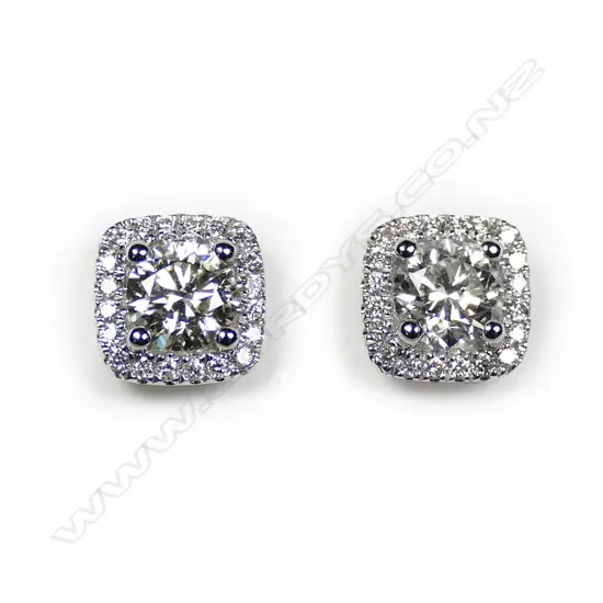 A pair of 18ct white gold and diamond square form earrings,