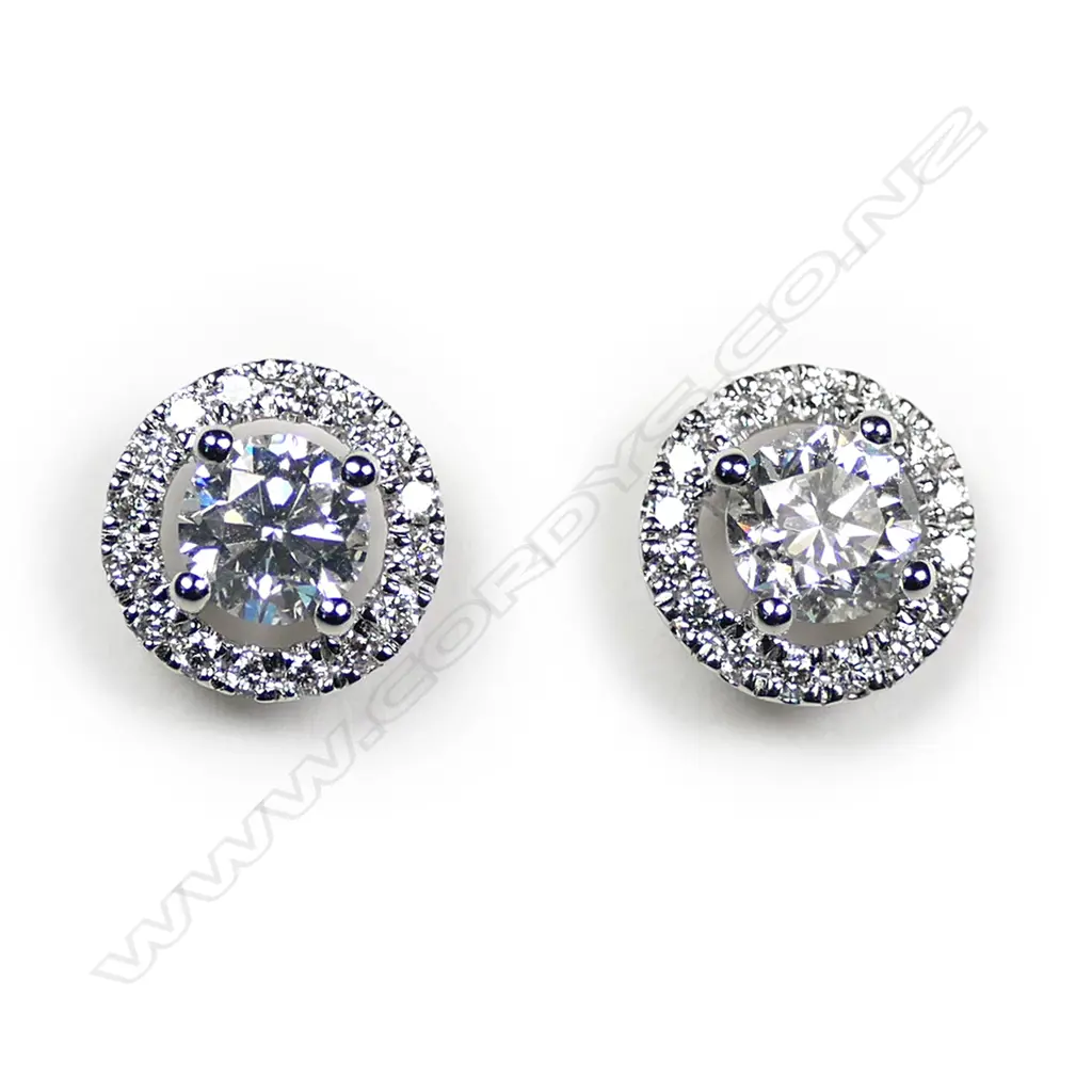 A pair of 18ct white gold and diamond round form earrings, Image 1++