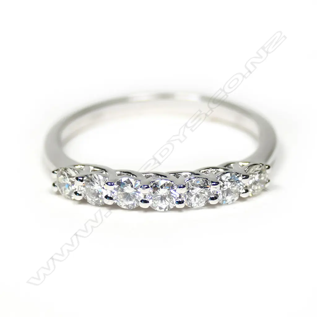 An 18ct white gold and seven diamond bridge ring, Image 1++