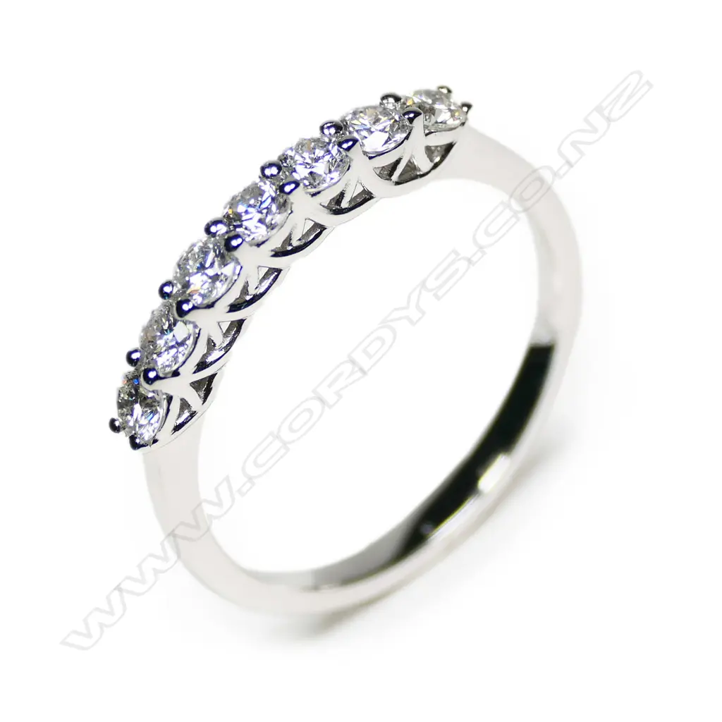 An 18ct white gold and seven diamond bridge ring, Image 1++