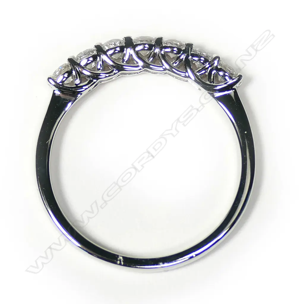 An 18ct white gold and seven diamond bridge ring, Image 1++