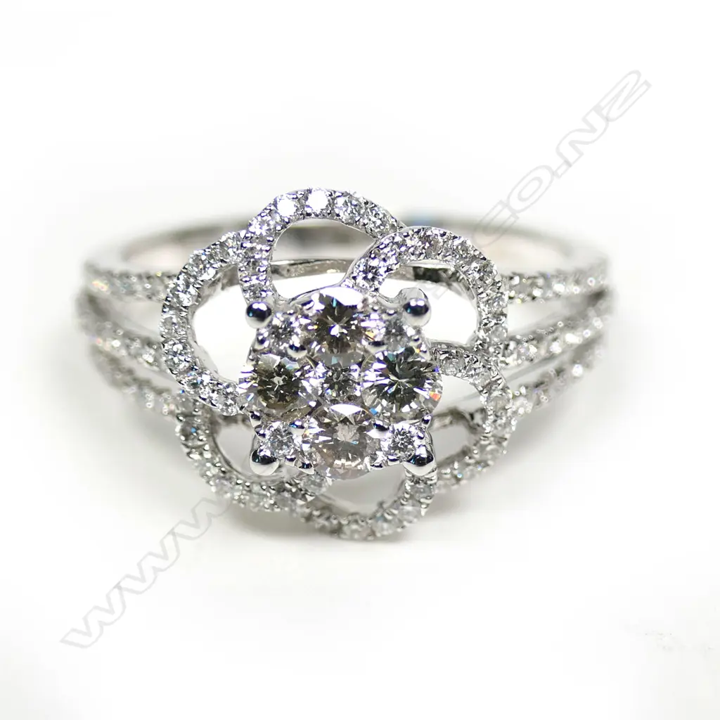 An 18ct white gold diamond cluster ring, Image 1++