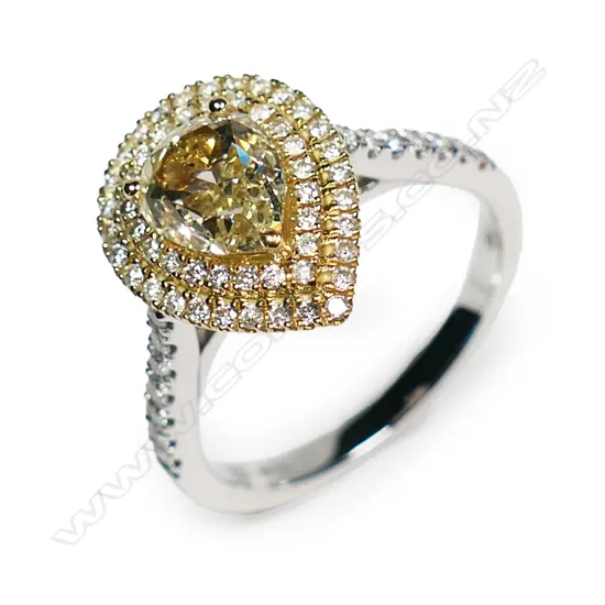 An 18ct white gold yellow and white diamond ring,