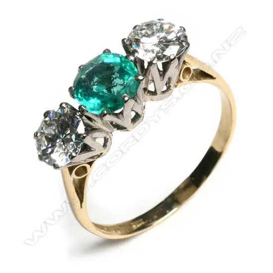 An estate 18ct gold emerald and diamond ring,