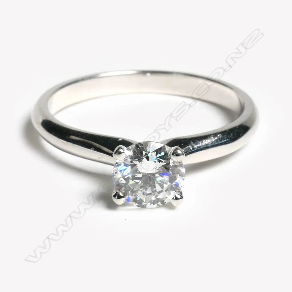 A 14ct white gold and diamond solitaire ring, Image 1++